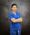 Asian Dental Assistant in Blue Scrub smiling with arms crossed.