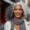 a woman with graying hair smiling