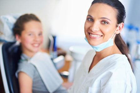 Home 2.0 5 a dentist and a patient during a teeth cleaning appointment