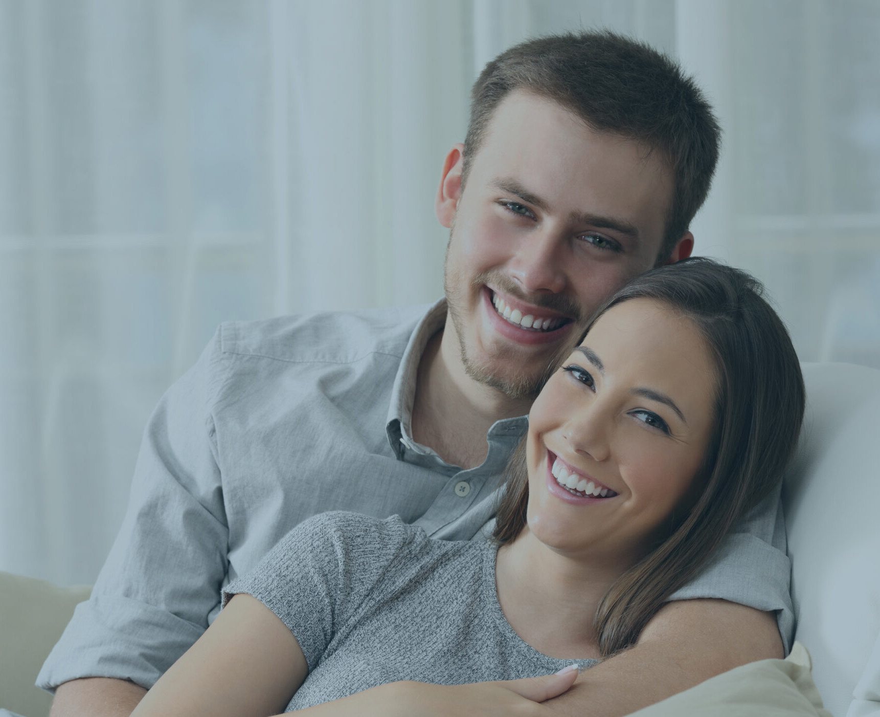a smiling couple with straight teeth