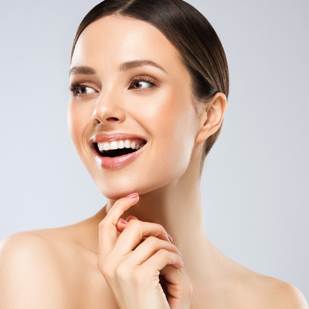 a woman with straight white teeth smiling